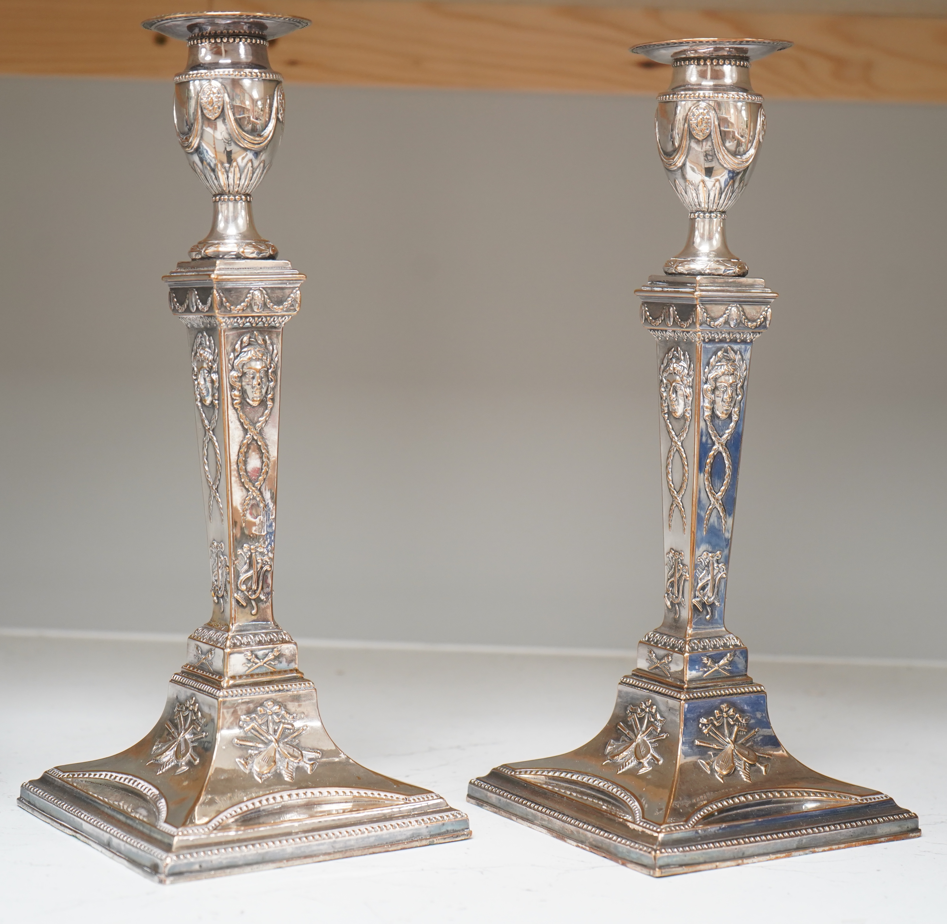 A pair of Adam design silver plated candlesticks, 29cm. Condition - worn